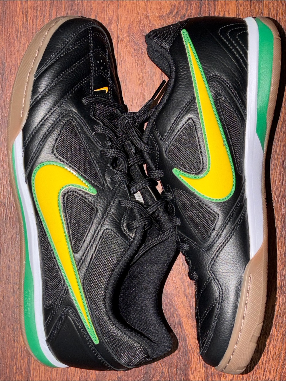 Nike size 10 Black Shoes with Yellow & Green Swoosh